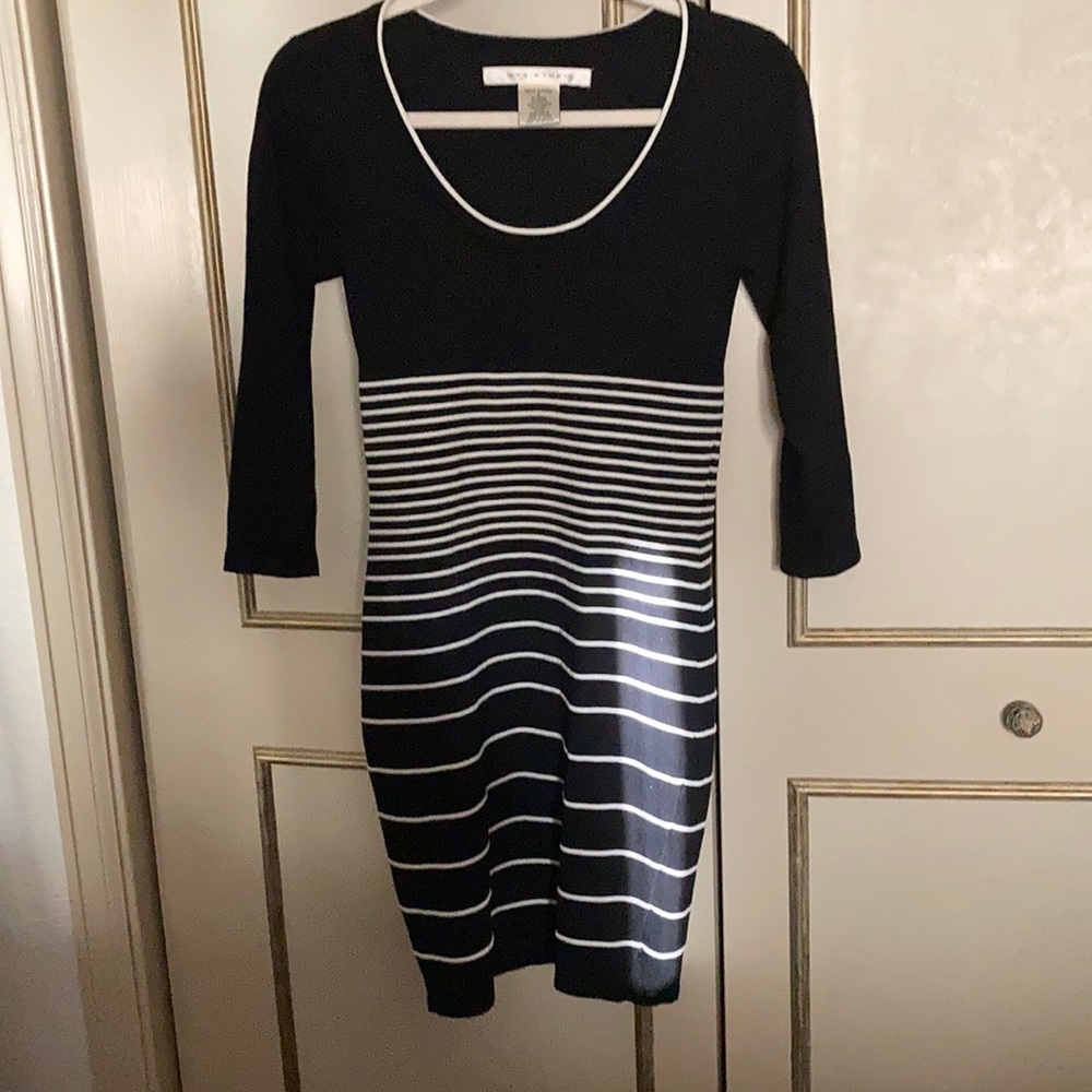Body skimming beautiful hardly worn sweater dress. VERY flattering!